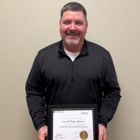 Director Receives National Certification